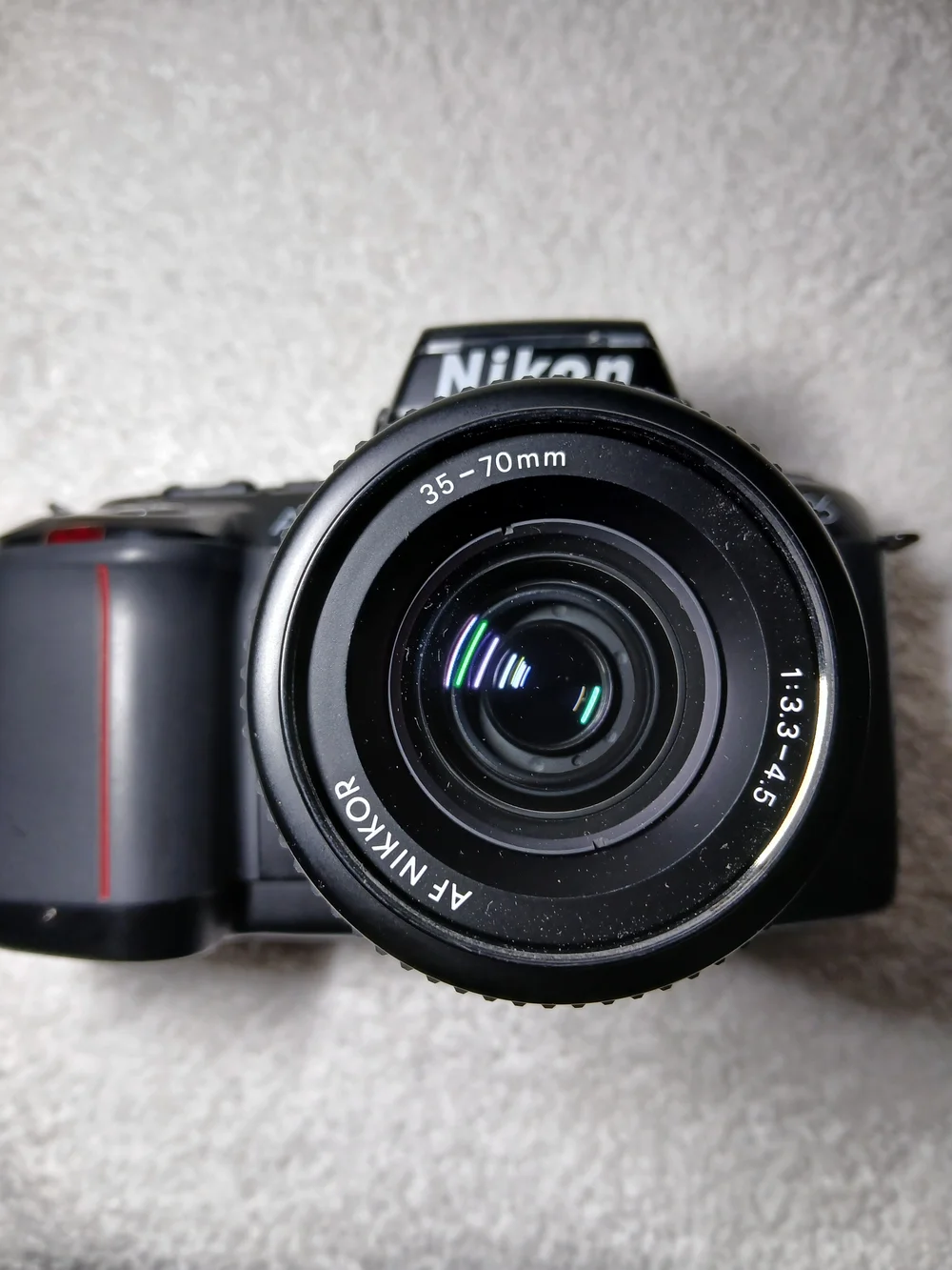 Nikon N6006 35mm autofocus SLR film camera. With Extra Lens and 2 Rolls Of Film.